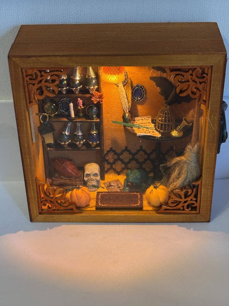 Miniature room box depicting an autumny witch's office