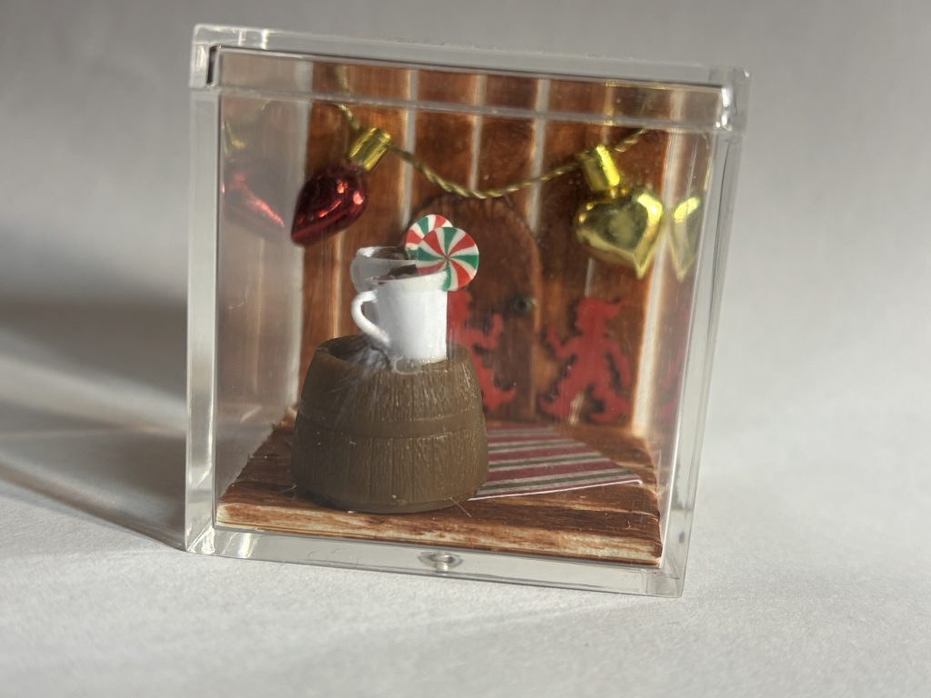 Miniature with a door and two mugs of hot chocolate